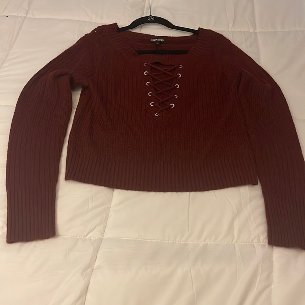 Burgundy sweater with crisscross Opening in the front